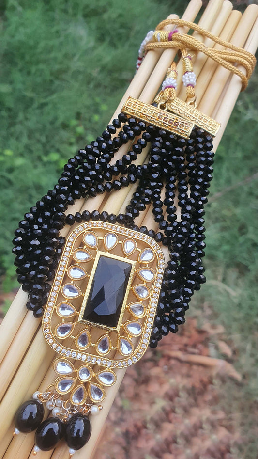 black kundan neckace with earrings