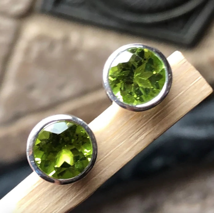 Round cut peridot stud earrings